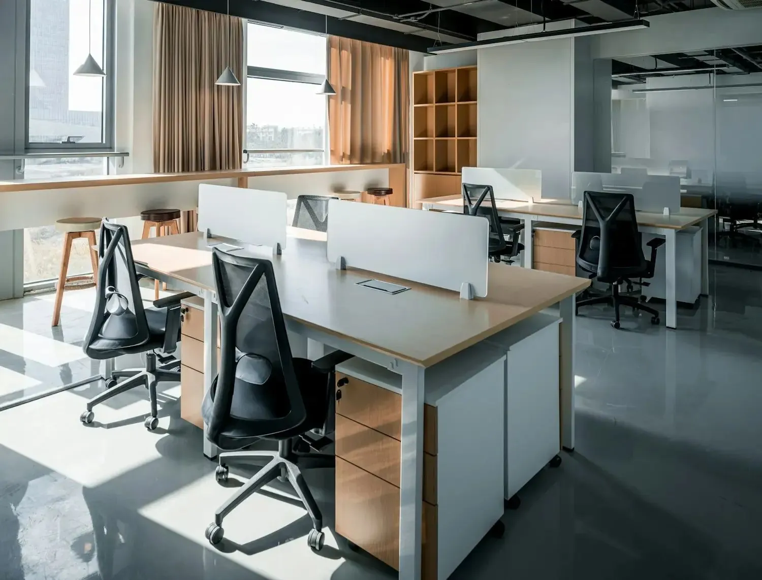 Renovated office with desk, chairs and large window