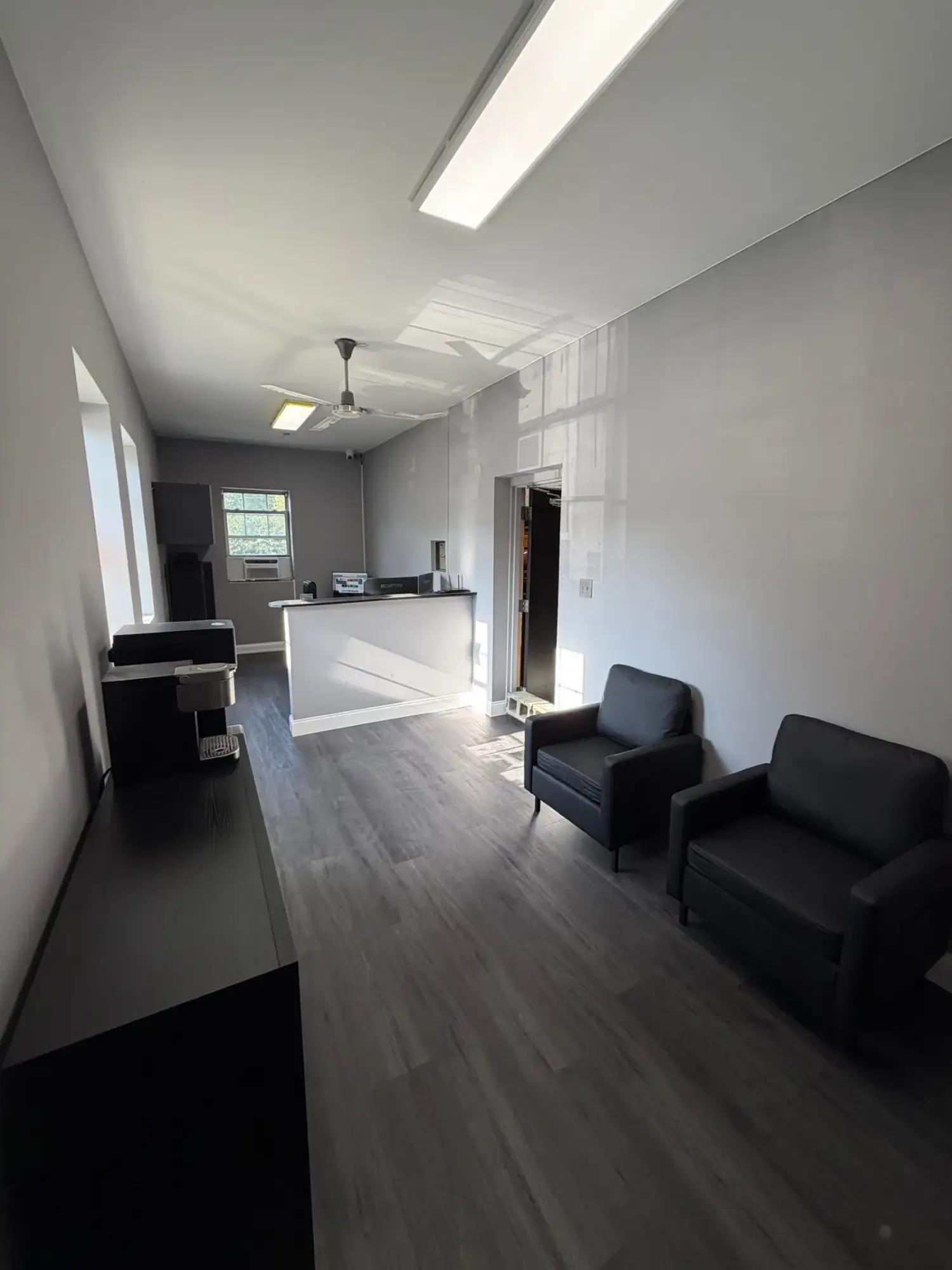 Finished waiting area with new chairs and plank flooring