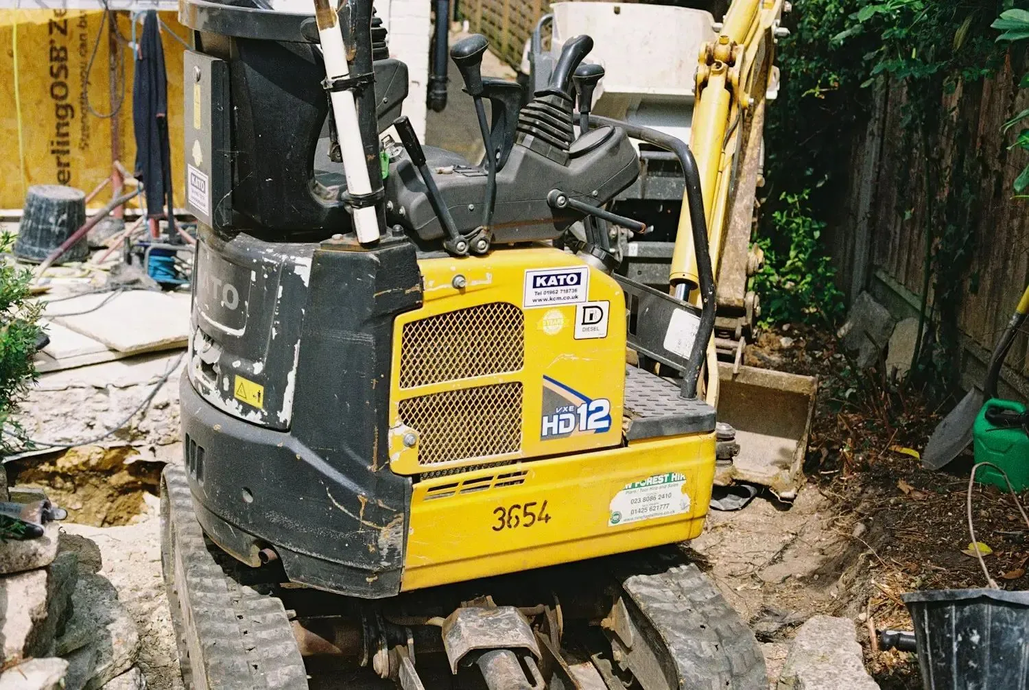 Mini excavator on a dirt construction site
