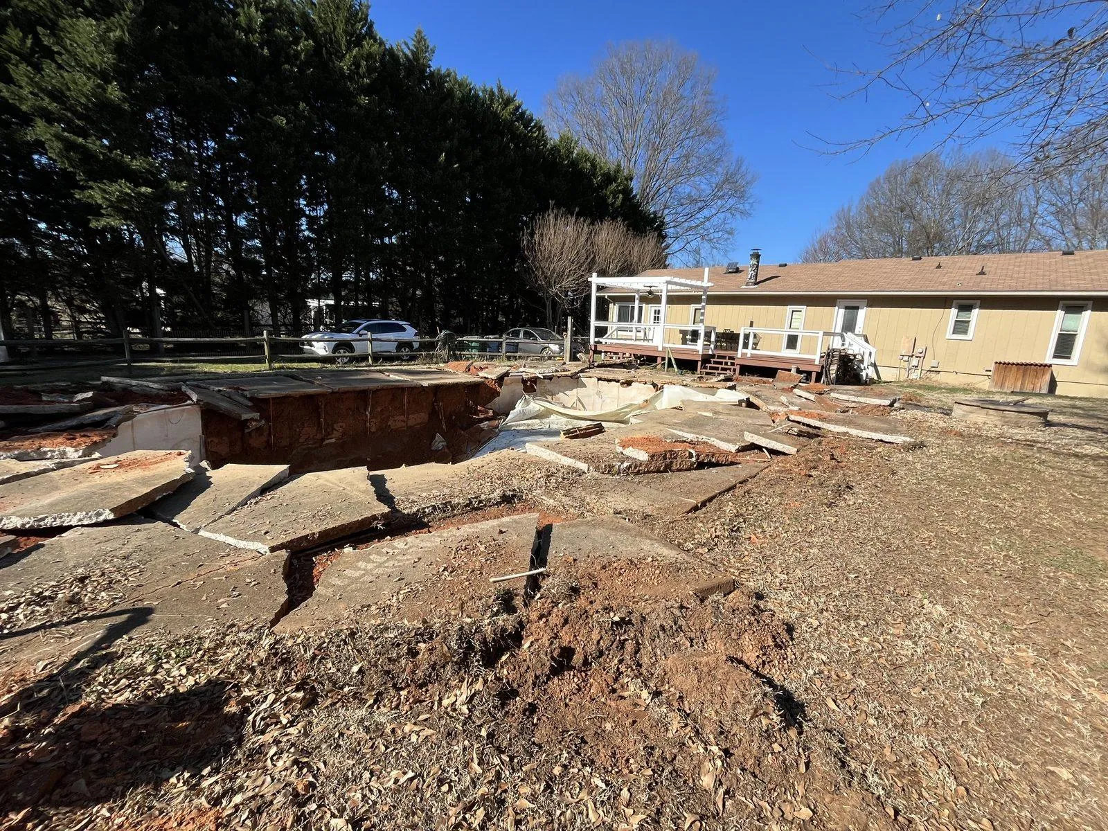 Pool shell and deck slabs being broken out